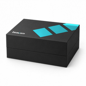 Beakom retail box, closed, matte black lid with teal signal bars and the beakom wordmark, on white.
