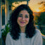 Portrait of a Beakom customer on her porch at golden hour